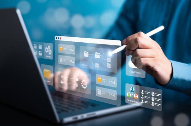 istockphoto-1744729415-612×612 Businessman using laptop to manage file document on company server. DMS, Cloud backup online documentation, and digital storage software. Database upload and download. Permission access application.