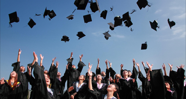 students topping their hats